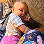 Winter joined the competition — help win amazing prizes! animal_print, baby, blanket, carpet, child, clothing, colorful, couch, curious, eyes, face, footwear, hand, indoor, infant, leaning, pajamas, pink_pants, texture, white_shirt