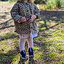 Lily a rejoint le concours — aidez-le/la à gagner de superbes lots ! toddler, child, smiling, leopard_print, jacket, outdoor, forest, nature, sunlight, shoes, black_shoes, leggings, pink_dress, grass, trees, daylight, happy, person, standing, young_child