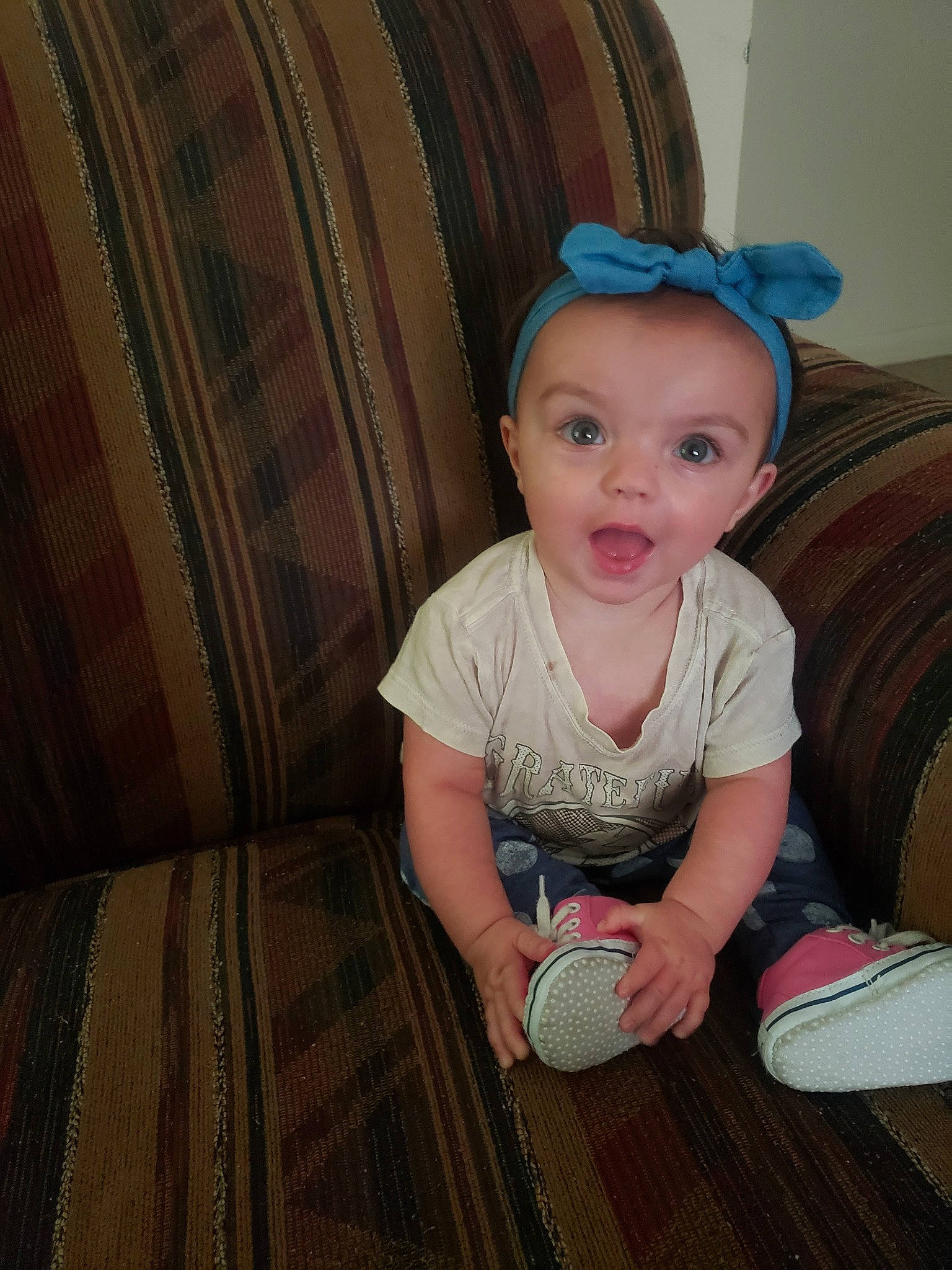 Abigail joined the competition — help win amazing prizes! baby, cheek, child, ear, eye, face, head, iris, person, sitting, skin, smile, surprise, toddler, wood