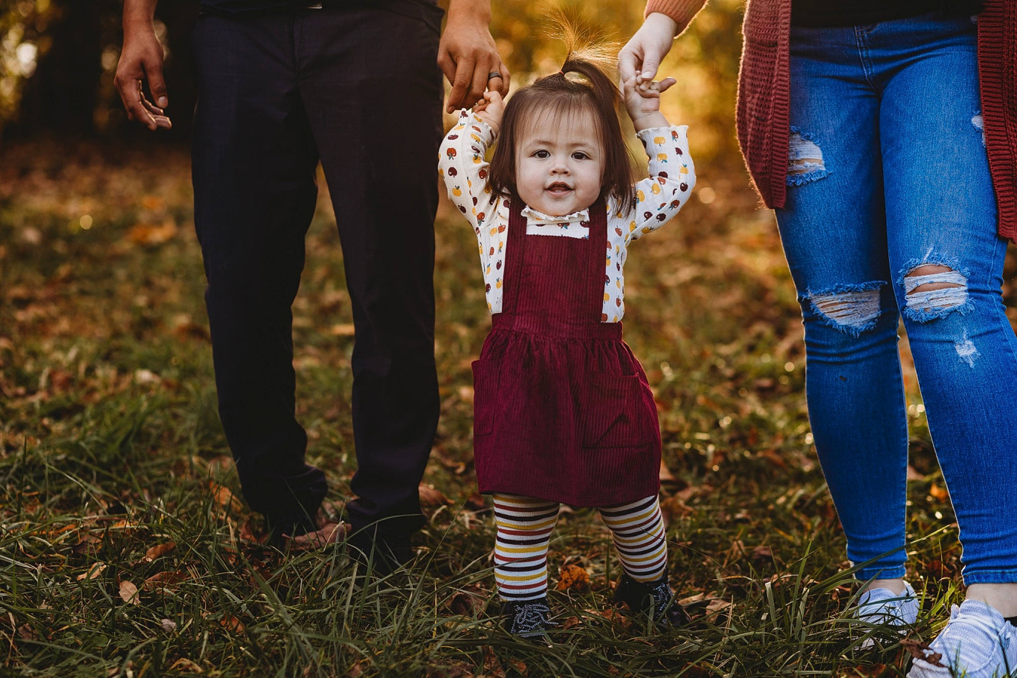 Amalia joined the competition — help win amazing prizes! baby, boot, dress, event, flash_photography, fun, gesture, grass, grassland, happy, holding_hands, jeans, lawn, people_in_nature, person, plant, shoe, toddler, tree, trousers