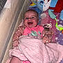 Oakleigh Mae is registered to the contest to win money with this photo: baby, blanket, crib, toy, bottle, smile, infant, pink, happy, face, clothing, child, indoor, cute, person, plush_toy, pacifier, sleeping_area, soft_toy, nursery