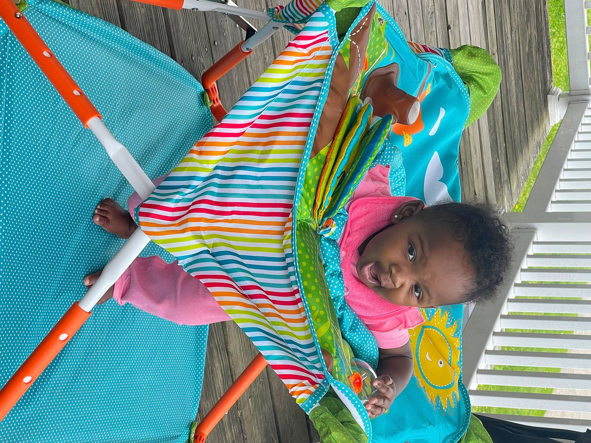 Lailani joined the competition — help win amazing prizes! baby, child, event, fun, grass, green, happy, leisure, magenta, pattern, person, play, recreation, sitting, textile, toddler, tree, vacation, water