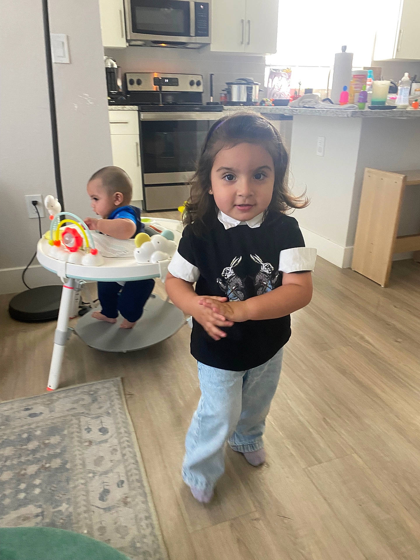 Frida is registered to the contest to win money with this photo: architecture, baby, building, chair, child, clothing, diningroom, diningtable, face, female, furniture, girl, head, indoors, pants, person, photography, portrait, room, table