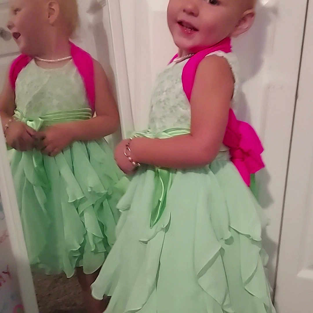 Aziza is registered to the contest to win money with this photo: accessories, child, clothing, costume, door, dress, eveningdress, face, fashion, female, formalwear, girl, gown, head, jewelry, necklace, person, photography, portrait, skirt