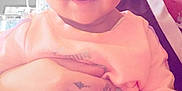 Zariyah joined the competition — help win amazing prizes! adult, affection, baby, child, closeup, face, family, glasses, hand, happy, holding, indoor, infant, nose_ring, person, pink_clothing, portrait, ring, smile, tattoo