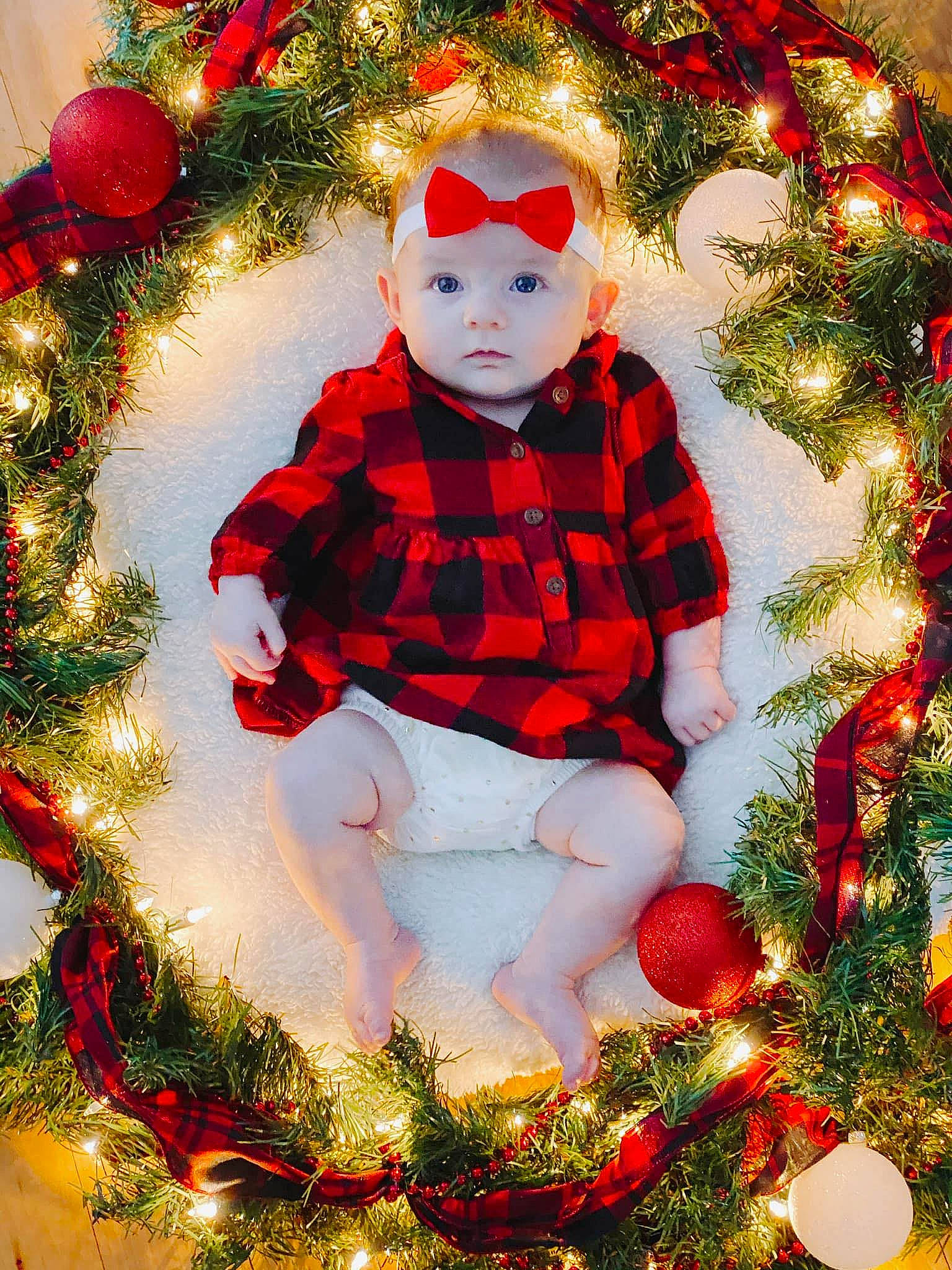 Finley joined the competition — help win amazing prizes! baby_toddler_clothing, christmas, christmas_decoration, christmas_ornament, christmas_tree, evergreen, facial_expression, happy, headwear, holiday, holiday_ornament, light, lighting, ornament, people_in_nature, person, plant, red, sleeve, toddler