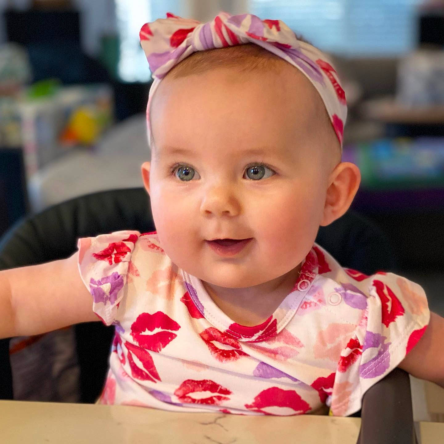 Finley is registered to the contest to win money with this photo: baby, baby_toddler_clothing, cheek, child, chin, eyelash, fashion_accessory, fun, happy, iris, jewellery, lip, neck, person, pink, skin, sleeve, smile, sweetness, table