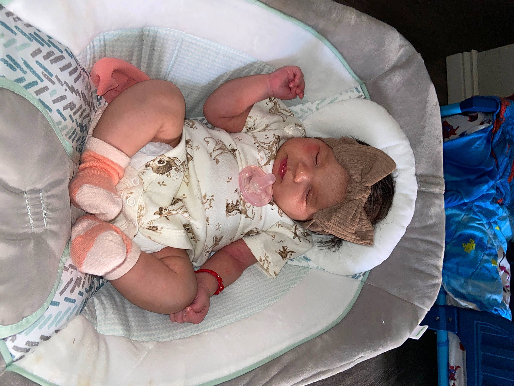 Rosalia is registered to the contest to win money with this photo: baby, baby_products, baby_safety, baby_sleeping, baby_toddler_clothing, bedtime, blue, child, comfort, eye, hand, hat, headwear, human_body, infant_bed, linens, nap, person, room, sitting