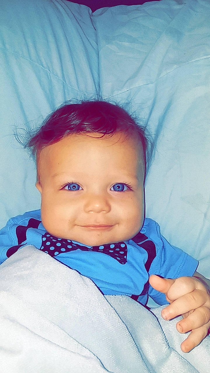 Knowledge is registered to the contest to win money with this photo: baby, baby_products, blue, cheek, child, chin, eye, face, finger, forehead, head, iris, joy, lip, mouth, nose, person, product, skin, smile