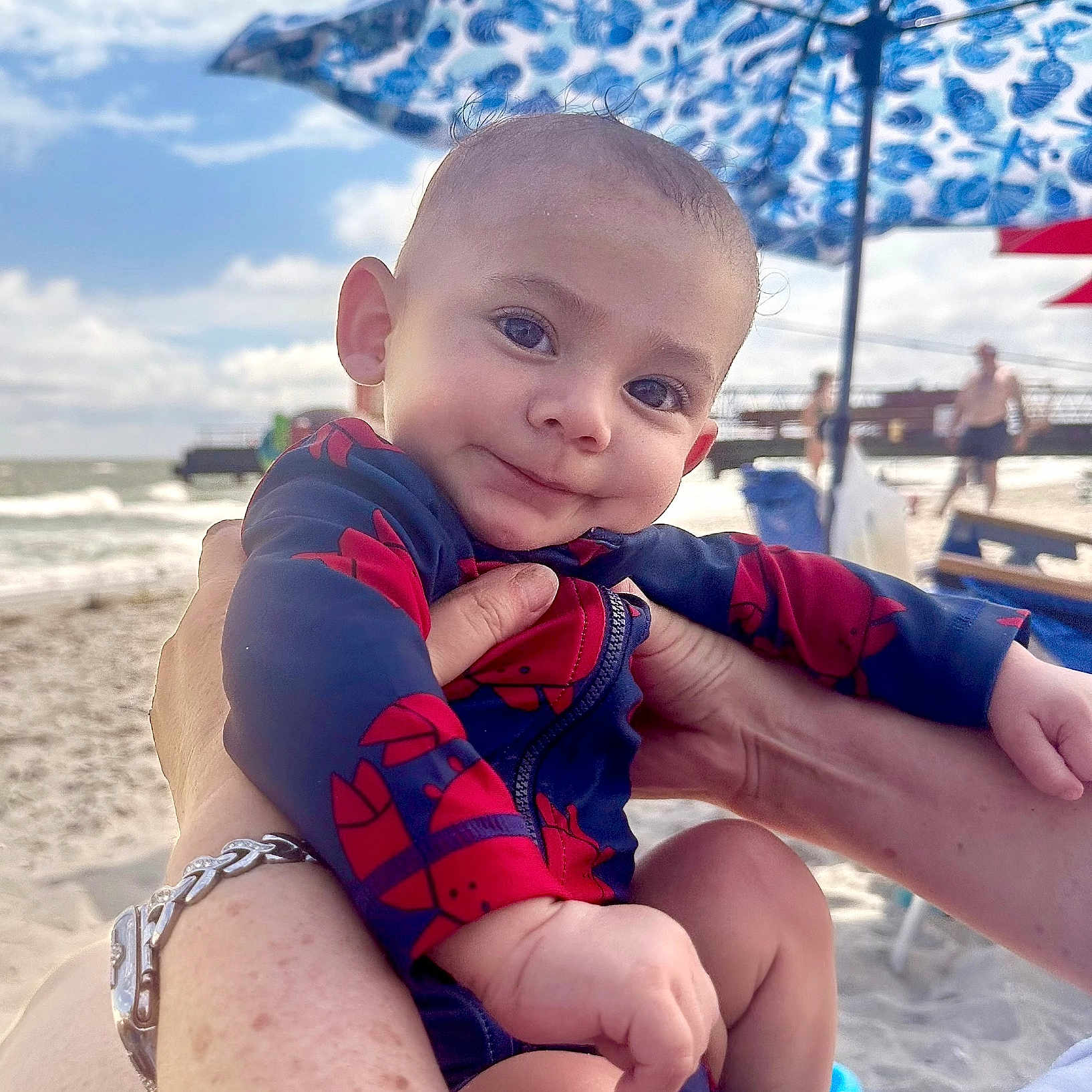 Declan joined the competition — help win amazing prizes! accessories, architecture, beach, bracelet, building, clothing, coast, face, head, jewelry, nature, outdoors, person, photography, portrait, sea, shelter, shoreline, swimwear, water