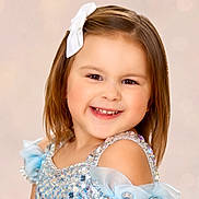 Shaylen joined the competition — help win amazing prizes! bow, child, childhood, closeup, cute, dress, face, fashion, girl, glamour, happy, innocence, joy, portrait, posing, pretty, smile, sparkles, studio, young