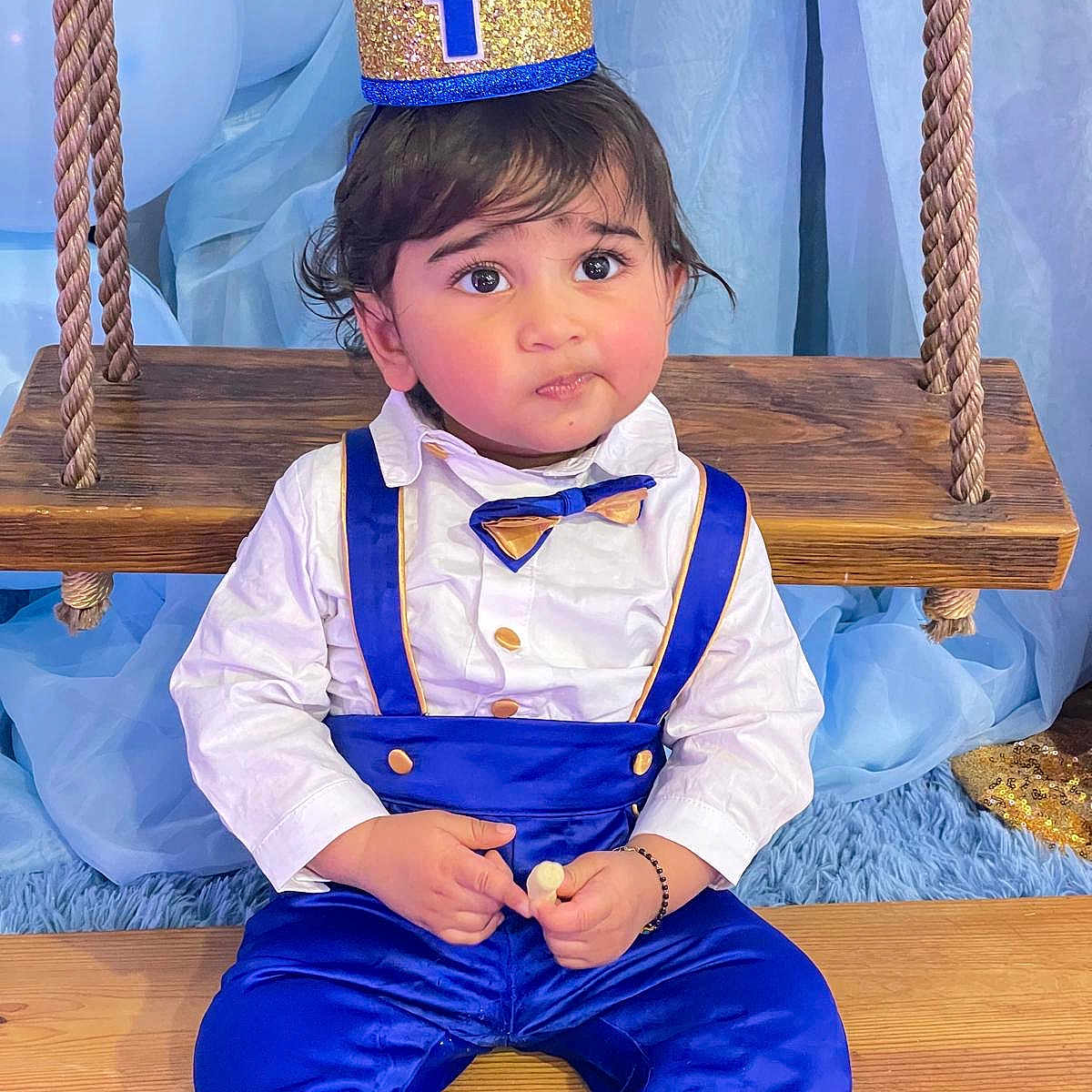 Adhiraj is registered to the contest to win money with this photo: accessories, boy, child, clothing, formalwear, hardwood, male, person, sitting, sleeve, student, tie, wood