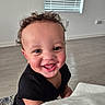toddler, child, smile, happy, curly_hair, indoor, floor, window, blinds, black_shirt, person, baby, closeup, portrait, candid, joyful, skin, face, young_child, home