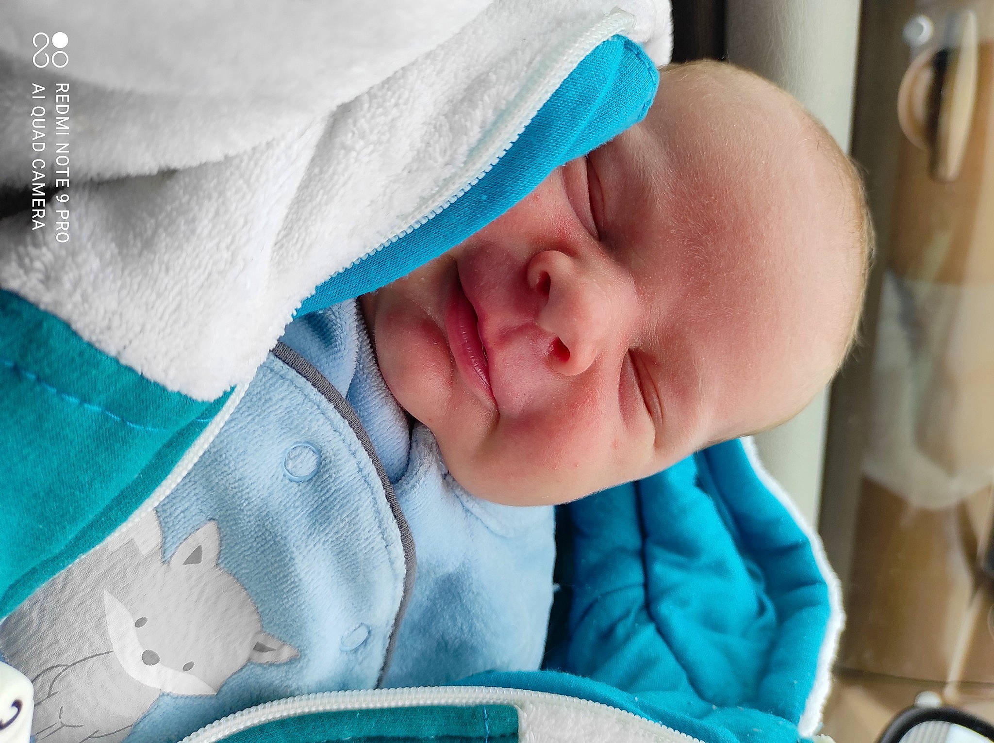 Zhack a rejoint le concours — aidez-le/la à gagner de superbes lots ! aqua, azure, baby, baby_products, baby_sleeping, baby_toddler_clothing, blue, cheek, child, close_up, comfort, finger, happy, linens, mouth, nose, person, product, skin, textile