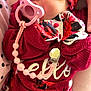 Layna joined the competition — help win amazing prizes! baby, newborn, sleeping, pacifier, headband, floral, red, pink, clothing, person, hands, cute, infant, resting, soft, closeup, portrait, wearing, fabric, pattern