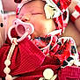 baby, sleeping, pacifier, headband, mittens, red_clothing, closeup, infant, cute, peaceful, soft_light, portrait, accessory, fabric, clip, hand, skin, face, newborn, cozy