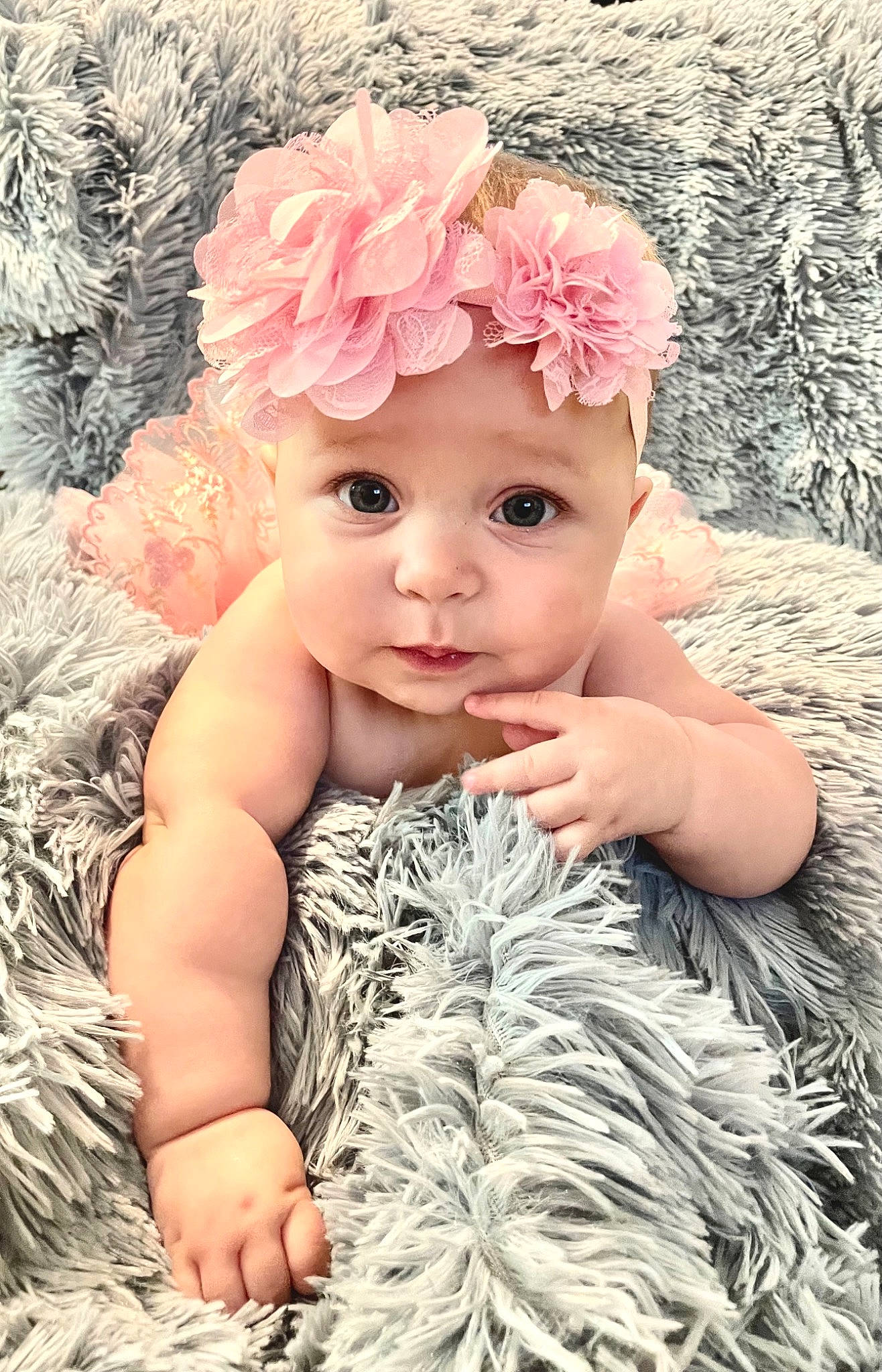 Callie is registered to the contest to win money with this photo: baby, baby_toddler_clothing, beauty, cheek, eye, eyelash, face, flower, head, headband, headgear, headpiece, headwear, iris, jewellery, lip, person, petal, pink, skin