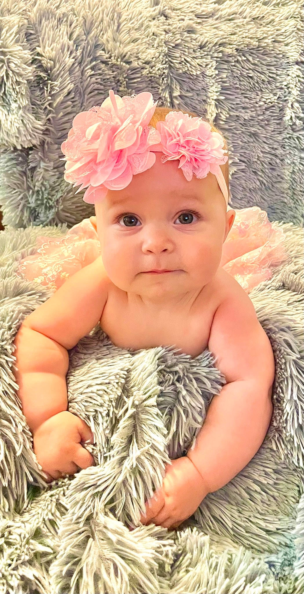 Callie is registered to the contest to win money with this photo: baby, baby_toddler_clothing, child, costume_hat, event, fashion_accessory, flower, grass, hair_accessory, happy, headband, headpiece, headwear, jewellery, nail, pattern, people_in_nature, person, petal, skin