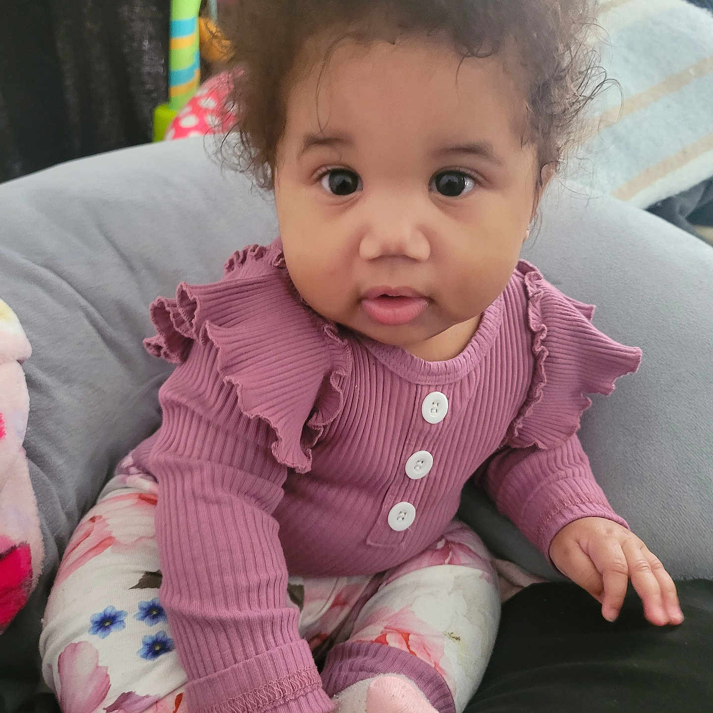 Bella Amore is registered to the contest to win money with this photo: baby, bodypart, clothing, couch, cushion, face, finger, furniture, hand, head, homedecor, hosiery, knitwear, pants, person, photography, portrait, sitting, sock, sweater