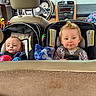 baby, car_seat, infant, child, vehicle_interior, toy, blanket, seatbelt, car, dashboard, steering_wheel, headrest, clothing, safety, cute, face, blue_eyes, hair, seat, interior