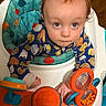 Dale joined the competition — help win amazing prizes! baby, child, walker, toy, blue_eyes, cookie_pattern, orange_toy, colorful, indoor, curious, clothing, seat, play, hands, face, person, wood_floor, expression, closeup, infant