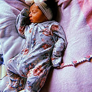 Kasiah joined the competition — help win amazing prizes! baby, sleeping, onesie, floral_pattern, headband, bow, blanket, soft_texture, infant, peaceful, closeup, indoors, cute, newborn, resting, toddler, child, comfort, lying_down, warm_lighting
