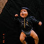 Kasiah is registered to the contest to win money with this photo: baby, black_clothing, blanket, casual_clothing, child, cozy, cute, happy, hoodie, human, indoors, infant, looking_up, lying_down, one_person, portrait, smiling, socks, texture, warm_light
