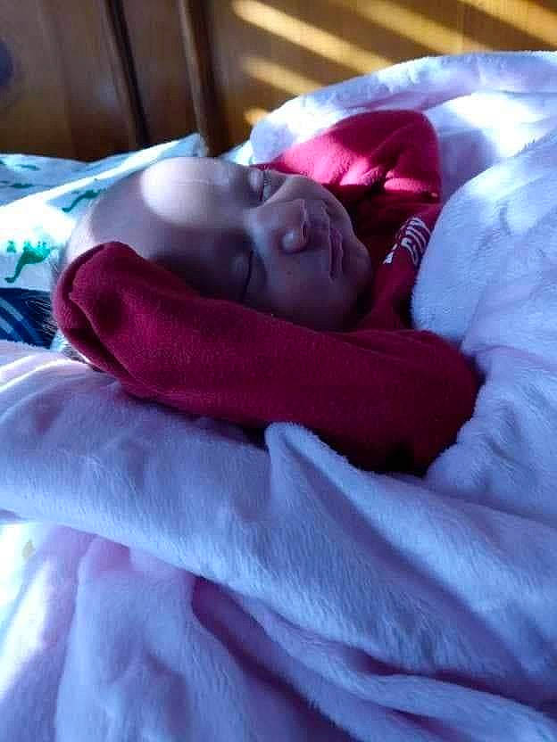 Korbin is registered to the contest to win money with this photo: baby, bedding, bedtime, child, comfort, electric_blue, eye, flesh, fun, fur, linens, magenta, nap, person, pink, purple, room, sleep, smile, toddler