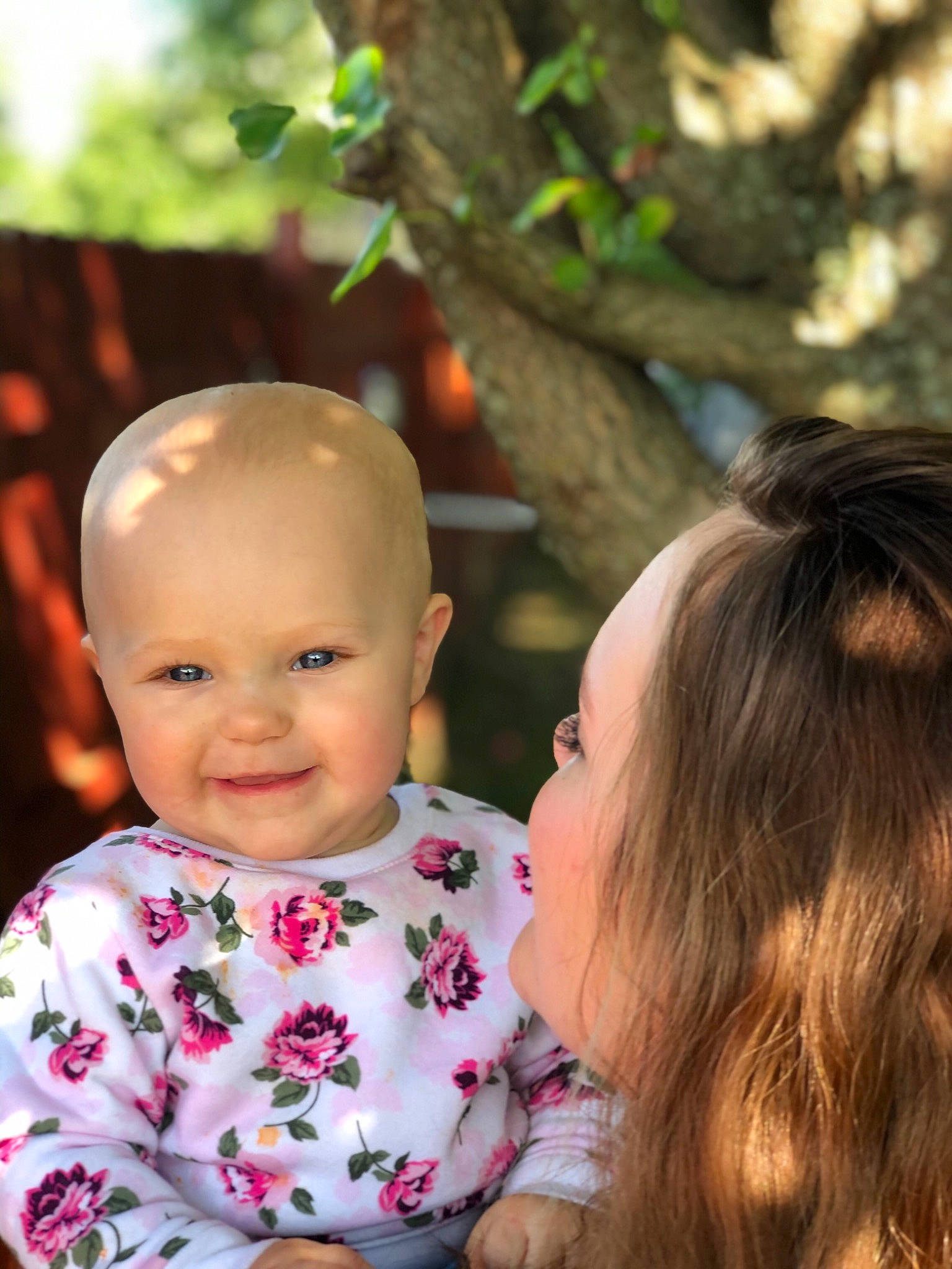 Carter is registered to the contest to win money with this photo: baby, child, face, family, fun, grass, happy, joy, people, person, plant, play, sibling, skin, smile, toddler, tree, vacation