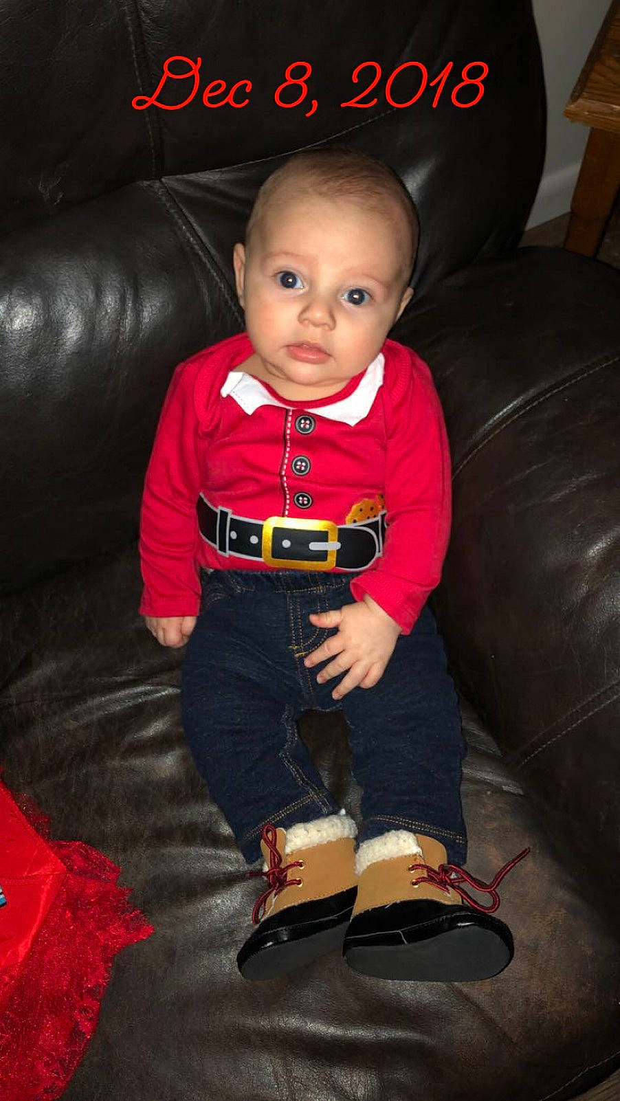 Dante is registered to the contest to win money with this photo: black, boy, child, cool, day, fun, person, product, red, sitting, toddler