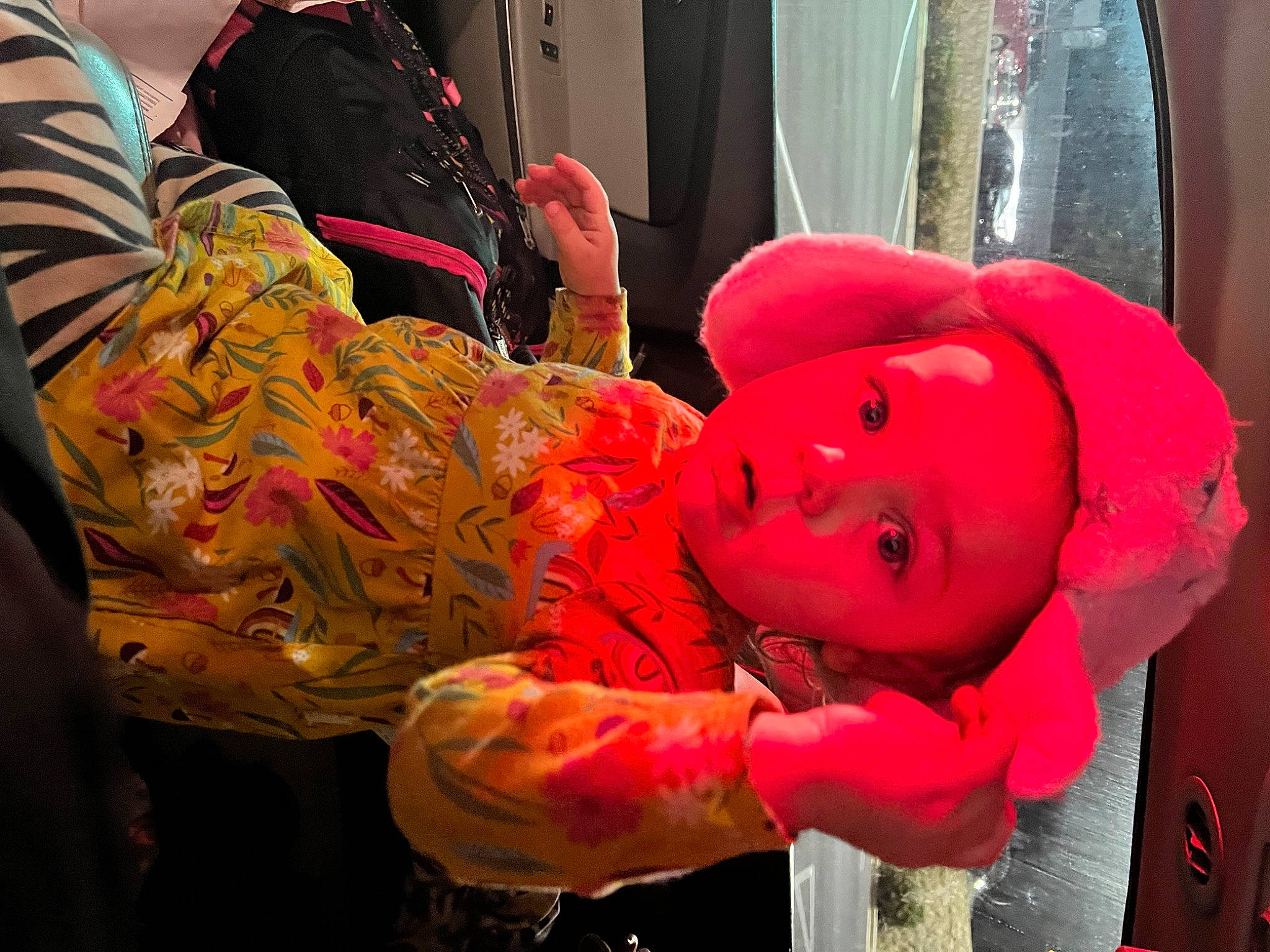 Everleigh is registered to the contest to win money with this photo: art, baby, carmine, child, costume, curtain, event, flesh, fun, hat, magenta, mouth, orange, person, pink, room, textile, toddler, tradition, vehicle_door