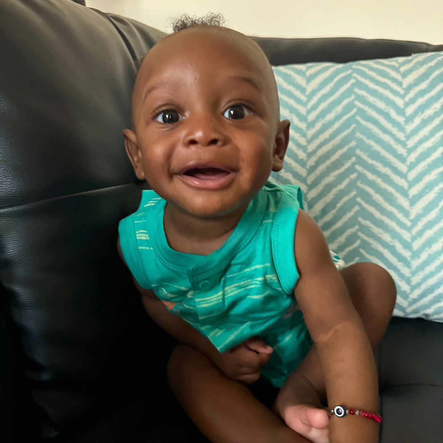 Mason is registered to the contest to win money with this photo: accessories, arm, baby, babylaughing, bodypart, couch, cushion, face, finger, furniture, hand, happy, head, homedecor, jewelry, person, photography, portrait, sitting, smile