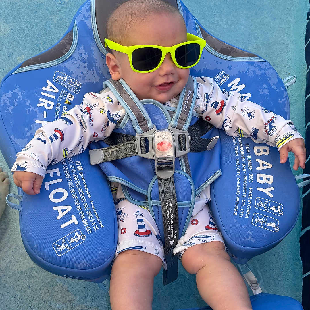 Hansel joined the competition — help win amazing prizes! baby, pool, float, sunglasses, water, blue, infant, smile, sunny, outdoor, child, swimming, safety, cute, relaxing, summer, fun, playful, seat, clothing