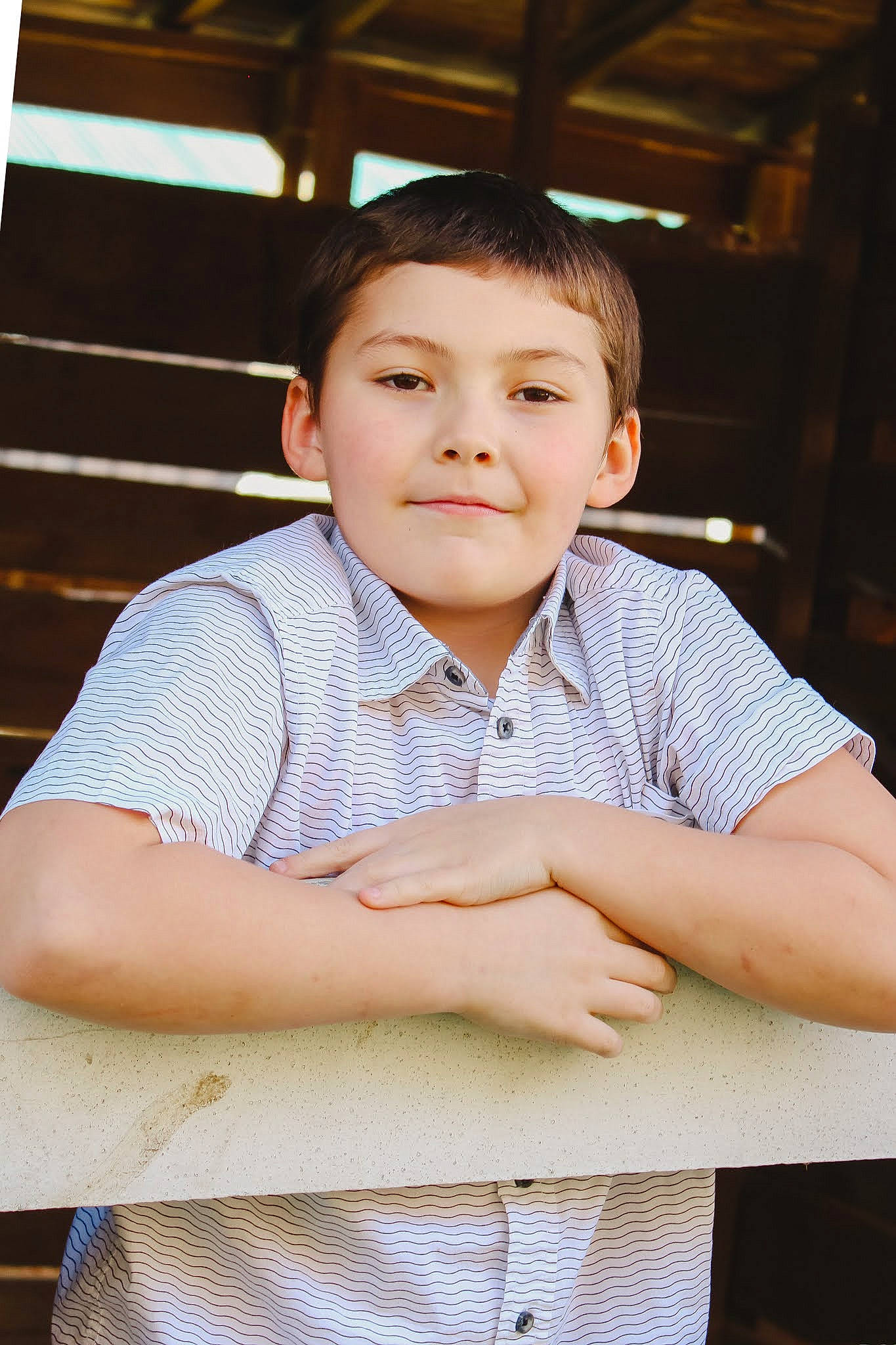 James is registered to the contest to win money with this photo: arm, black_hair, cheek, child, chin, collar, dress_shirt, elbow, eyebrow, flash_photography, forehead, fun, happy, neck, person, sitting, skin, sleeve, t_shirt, white_collar_worker