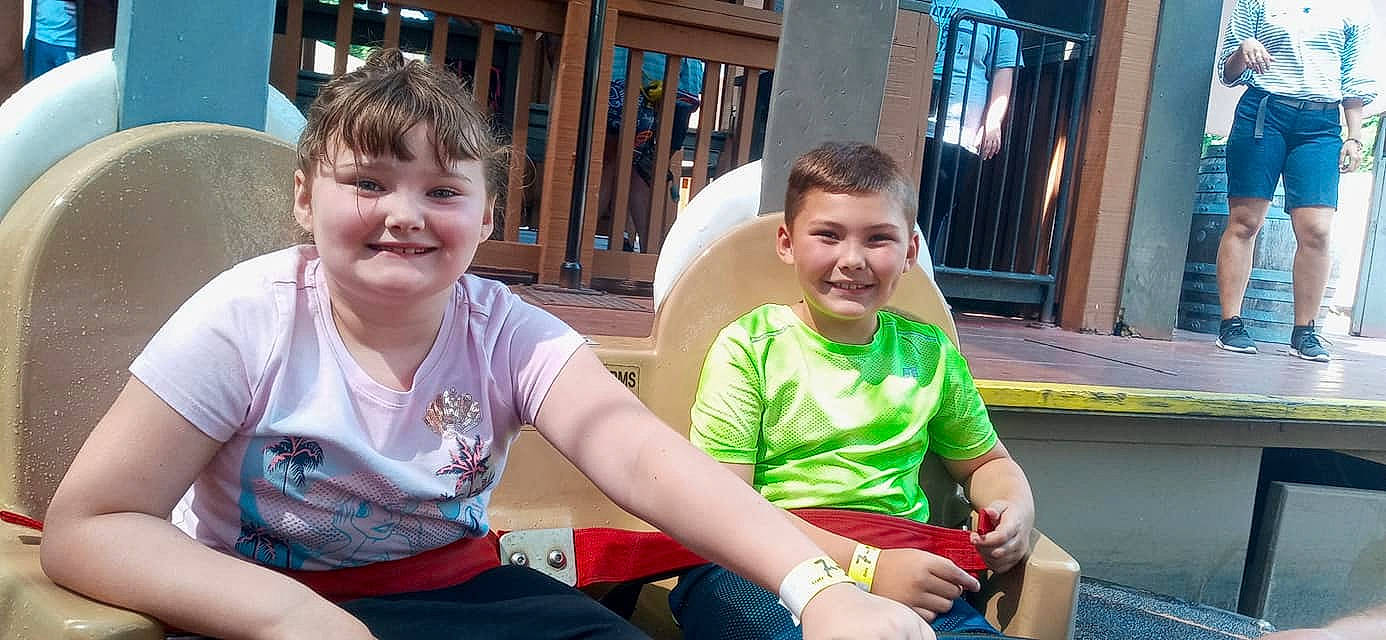 James joined the competition — help win amazing prizes! blue, child, eye, face, facial_expression, friendship, fun, grass, happy, joy, lap, leisure, people, person, recreation, sharing, shorts, skin, smile, summer