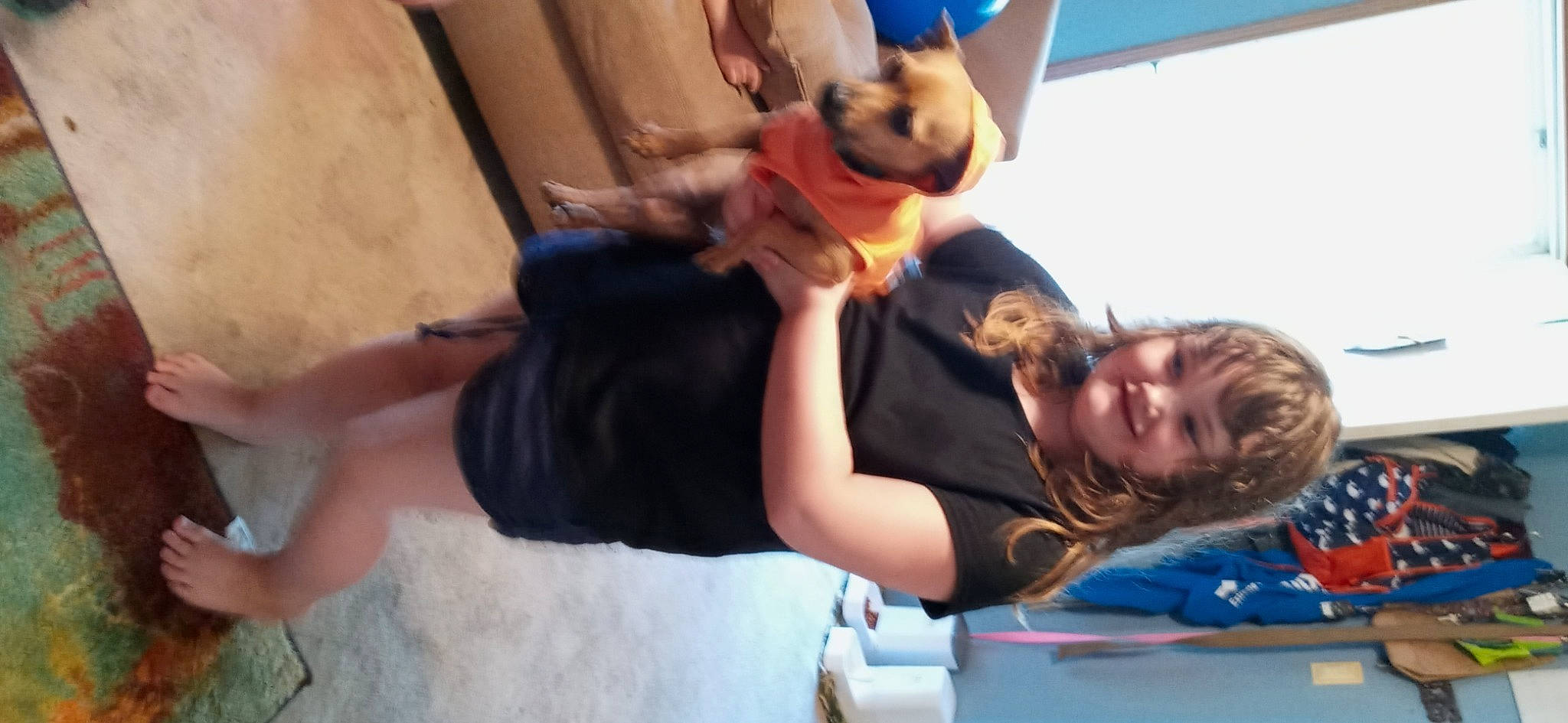 Rachel is registered to the contest to win money with this photo: adventure, child, elbow, event, fun, gesture, happy, human_leg, joy, knee, leisure, person, play, recreation, room, shorts, t_shirt, thigh, tree, vacation