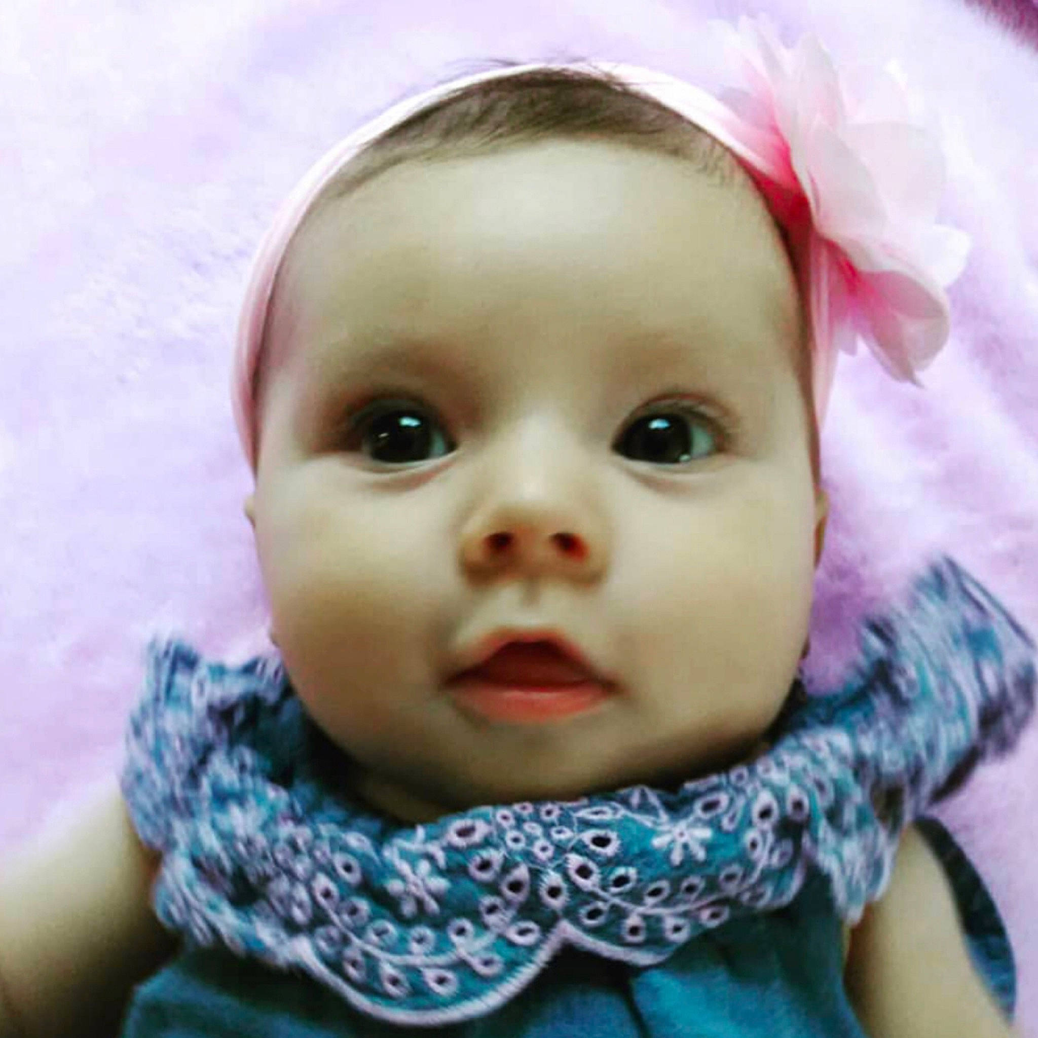 Jiana is registered to the contest to win money with this photo: baby, baby_making_funny_faces, cheek, child, chin, close_up, ear, eye, eyebrow, face, forehead, head, lip, mouth, nose, person, pink, skin, smile, toddler