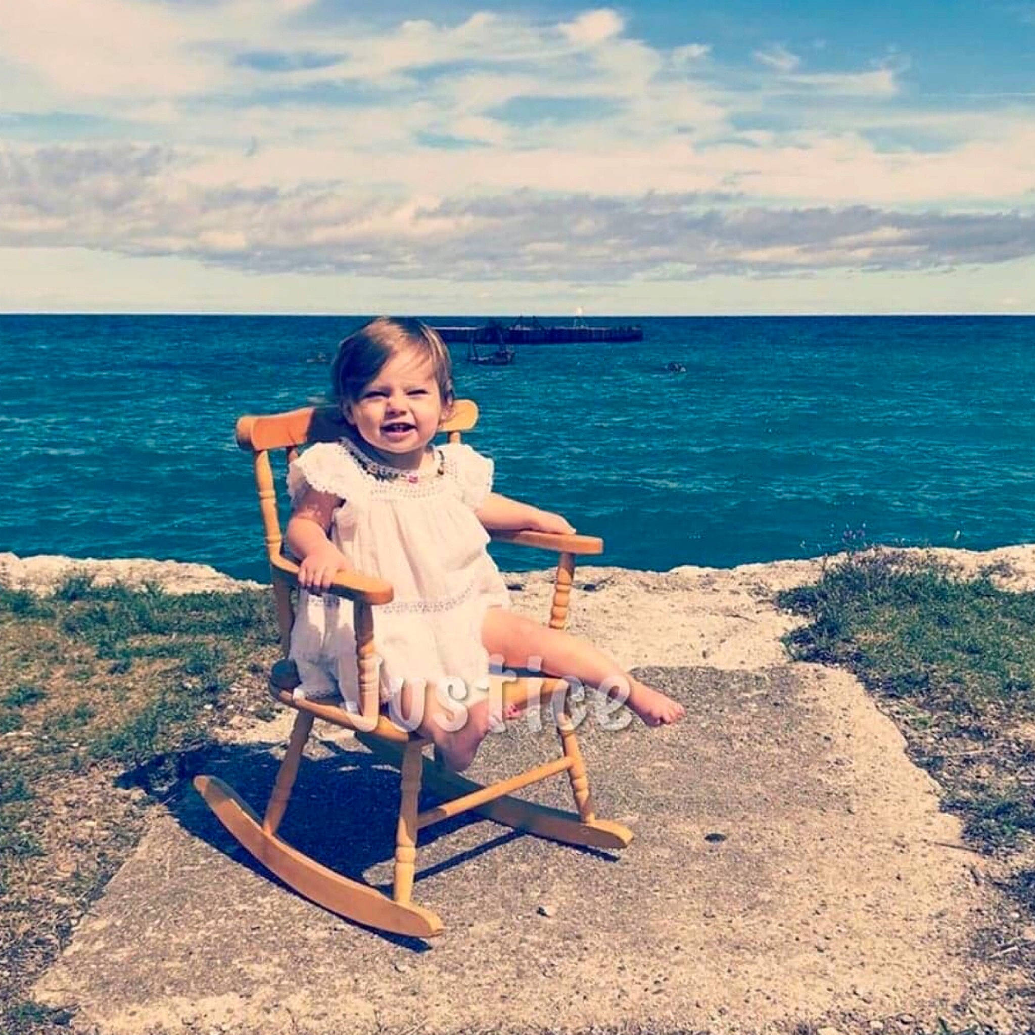 Jiana joined the competition — help win amazing prizes! beach, chair, child, cloud, coast, fun, furniture, happy, leg, leisure, ocean, person, photography, sea, shore, sitting, sky, smile, summer, turquoise
