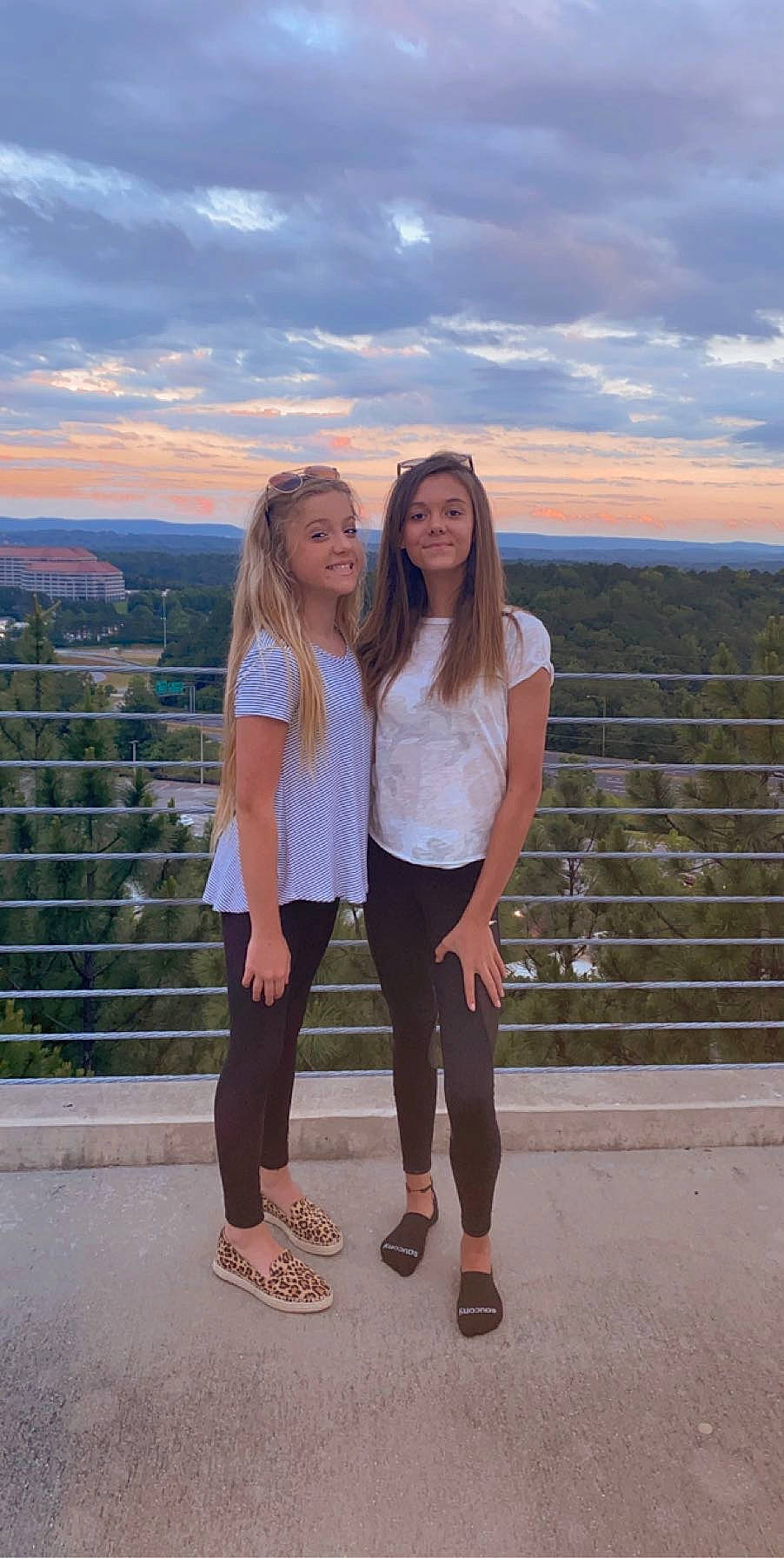 Kailyn is registered to the contest to win money with this photo: footwear, friendship, gesture, happy, honeymoon, joy, leg, leggings, leisure, long_hair, person, photograph, photography, shoe, smile, standing, summer, tourism, vacation