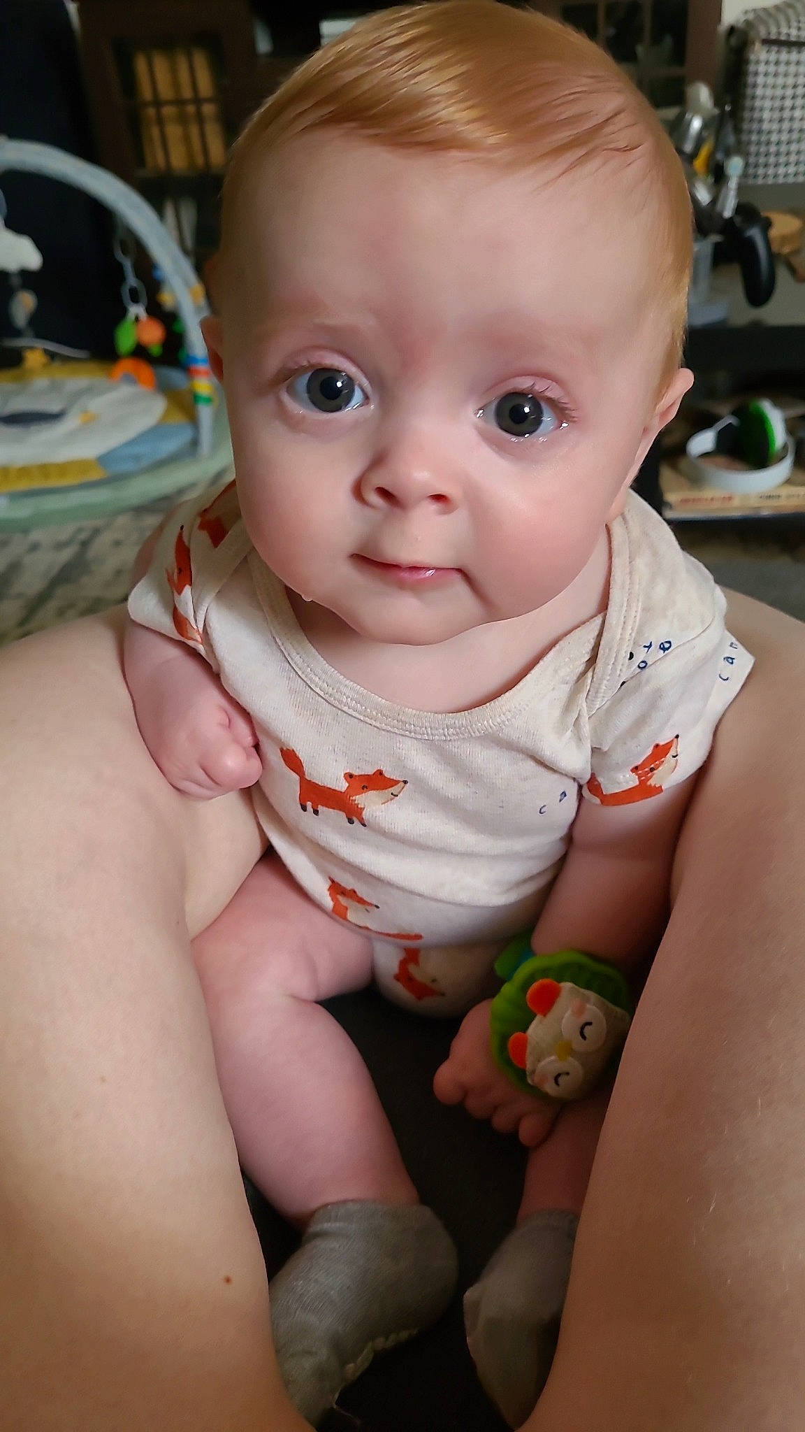 Caden is registered to the contest to win money with this photo: baby, baby_toddler_clothing, cheek, chin, dress, eye, face, finger, hand, head, human_body, iris, joint, lip, mouth, neck, nose, person, skin, sleeve