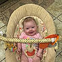 Nova is registered to the contest to win money with this photo: baby, infant, smile, baby_seat, toy, onesie, floor_tile, rug, cute, child, indoors, playful, happy, person, face, seat, colorful, soft_toy, baby_toys, comfort