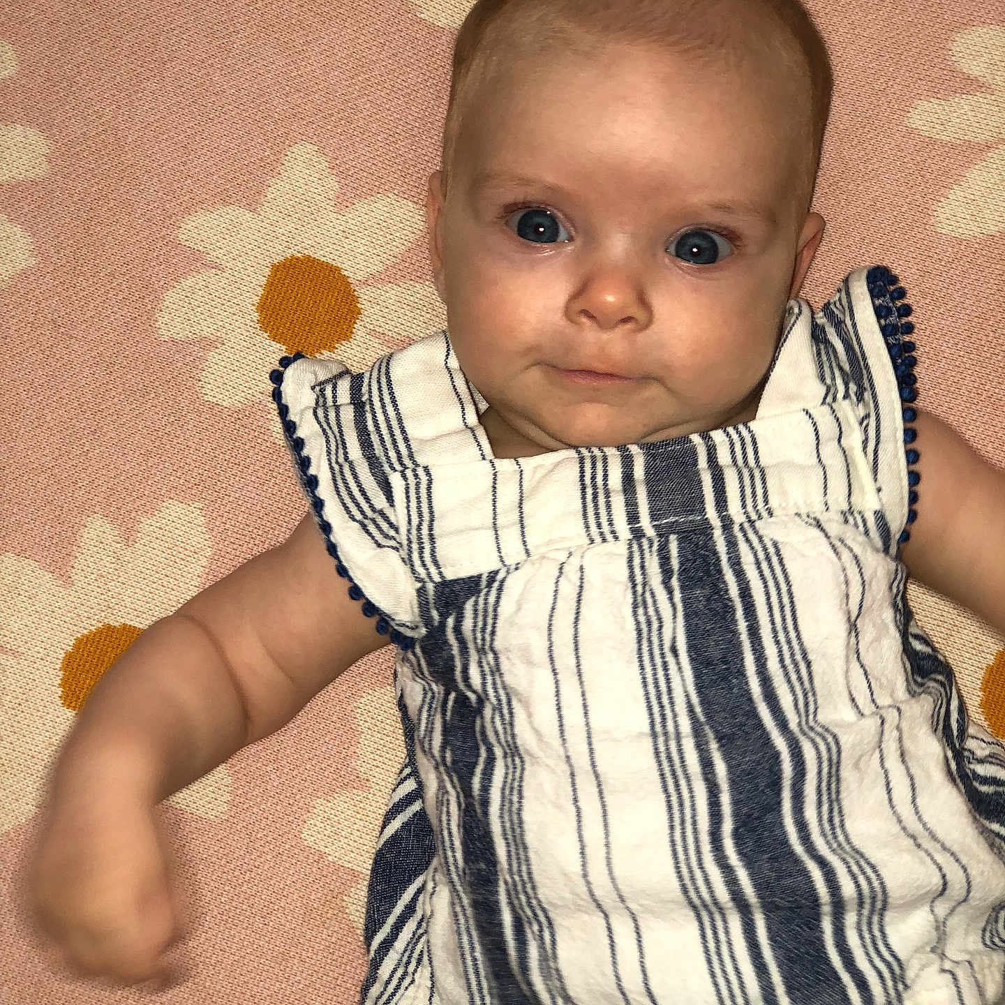 Riley joined the competition — help win amazing prizes! baby, bodypart, clothing, dress, face, finger, hand, happy, head, homedecor, linen, newborn, pants, person, photography, portrait, quilt, shirt, sitting, smile