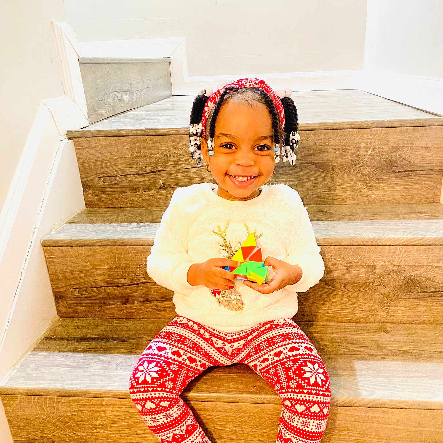 Kaylani joined the competition — help win amazing prizes! architecture, building, child, clothing, face, female, footwear, girl, hair, happy, hardwood, head, house, housing, person, shoe, sitting, smile, staircase, wood