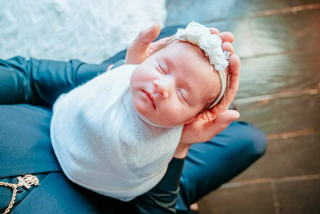 Kirah is registered to the contest to win money with this photo: baby, beanie, child, comfort, eyelash, eyewear, flash_photography, flooring, grass, happy, jewellery, leisure, nap, person, photo_shoot, portrait, portrait_photography, sitting, sleep, toddler