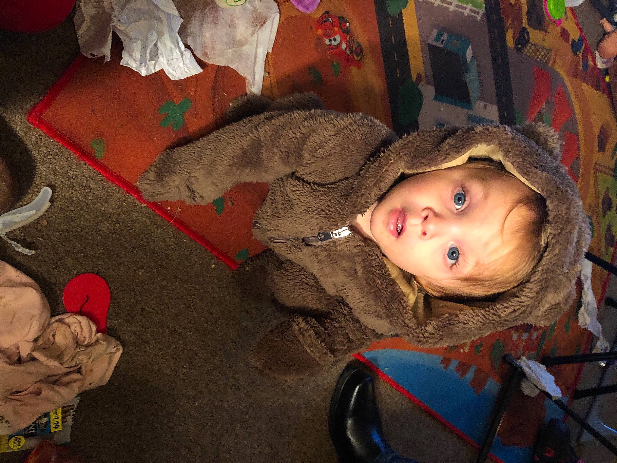 Harper is registered to the contest to win money with this photo: adaptation, baby, carmine, cheek, child, facial_expression, flooring, fun, hairstyle, head, headgear, human_body, iris, leaf, mouth, nose, person, skin, surprise, toddler