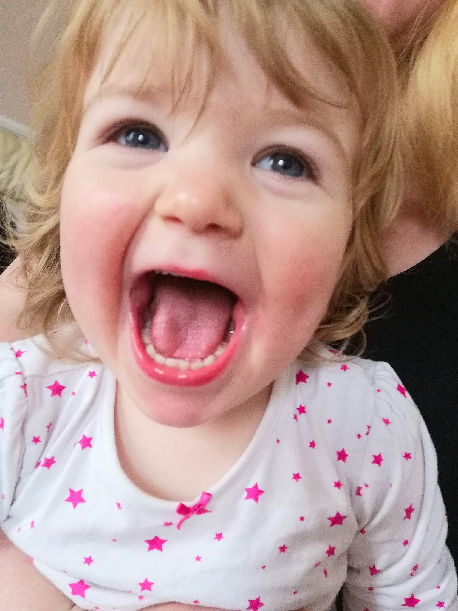 Evie is registered to the contest to win money with this photo: baby_toddler_clothing, cheek, chin, ear, eye, eyebrow, eyelash, facial_expression, gesture, happy, iris, jaw, lip, mouth, nose, organ, person, skin, smile, tongue