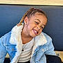 Elayana a rejoint le concours — aidez-le/la à gagner de superbes lots ! bench, black_pants, blue_wall, braids, casual_clothing, child, cute, denim_jacket, earrings, fashion, happy, indoor, jewelry, joy, necklace, portrait, sitting, smiling, white_boots, wood_panel