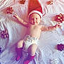 Benjamin joined the competition — help win amazing prizes! baby, infant, diaper, red_hat, red_socks, lying_down, white_sheet, gift_bows, decorations, chubby, happy, smiling, cute, child, soft_lighting, indoors, portrait, arms_outstretched, holiday_theme, playful