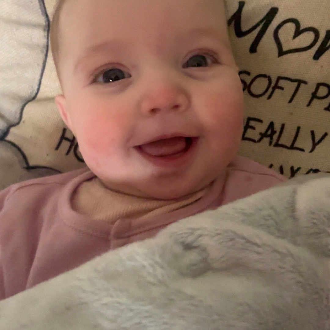 Bobbie-Leigh is registered to the contest to win money with this photo: baby, babylaughing, blanket, bodypart, cushion, face, finger, furniture, hand, happy, head, homedecor, laughing, linen, newborn, person, photography, portrait, quilt, smile