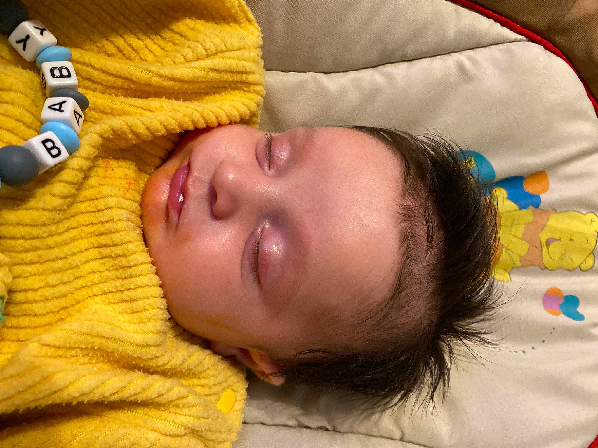 Owen a rejoint le concours — aidez-le/la à gagner de superbes lots ! baby, bedtime, cheek, child, close_up, comfort, fun, happy, linens, nap, nose, person, room, skin, sleep, toddler, yellow